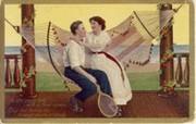 HAMMOCK ROMANCE WITH MAN HOLDING TENNIS RACQUET