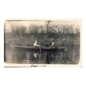 COUPLE IN A ROWING BOAT ON GENTLE WATER POSTCARD