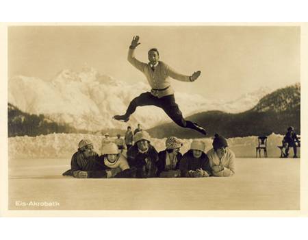 ACROBATIC SKATER LEAPING ABOVE A ROW OF MUFFLED LADIES (postcard)